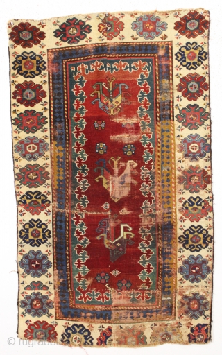 early caucasian rug rug fragment. Eye catching assemblage of fragments from an early and very fine caucasian rug. Unusually precise drawing and world class colors including some of the nicest old purple  ...