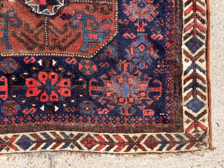 Early Baluch “octagon” bagface with first rate colors featuring as saturated a red and light blue as you can find. Eye catching field and attractive “fish bone” border. Fair condition for the  ...