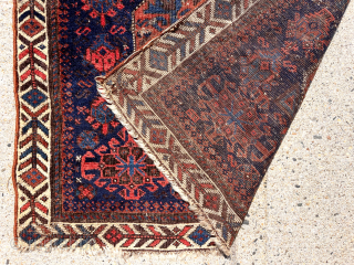 Early Baluch “octagon” bagface with first rate colors featuring as saturated a red and light blue as you can find. Eye catching field and attractive “fish bone” border. Fair condition for the  ...