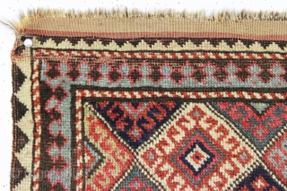 antique little mystery weaving. Looks like a kurdish piece but the weave, palette and tall format all indicate something else. Caucasian? All natural colors. Turkish knotted. Sides are original with weft returns.  ...