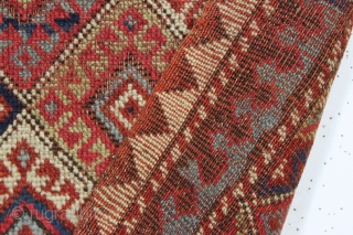 antique little mystery weaving. Looks like a kurdish piece but the weave, palette and tall format all indicate something else. Caucasian? All natural colors. Turkish knotted. Sides are original with weft returns.  ...