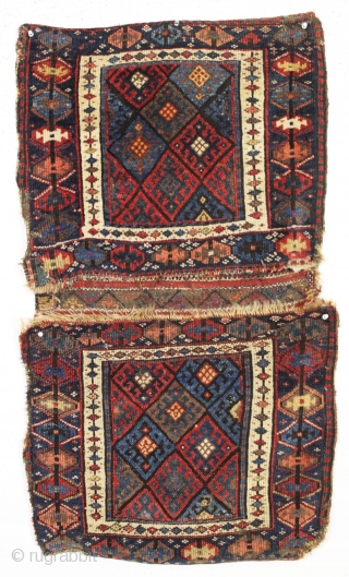 antique complete connected pair of kurdish bags with an unusual ashik gul border. Mostly good pile with a few spots of wear and edge roughnes. All natural colors featuring a nice aubergine,  ...