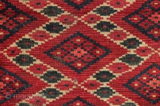 antique little turkoman ersari fragment with an interesting ikat type design. All natural colors featuring multiple reds deep green. Reasonably clean. Original goat hair 3 cord selvages. Good age, ca. 1880 or  ...