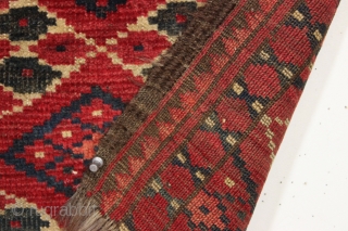 antique little turkoman ersari fragment with an interesting ikat type design. All natural colors featuring multiple reds deep green. Reasonably clean. Original goat hair 3 cord selvages. Good age, ca. 1880 or  ...