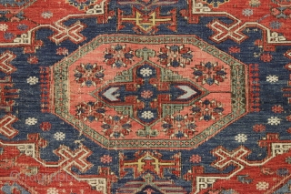 antique small soumak carpet. Classic design with some charming tribal elements including 12 rockects and 6 tiny people. Nice older example in good condition for the age. All natural colors featuring a  ...