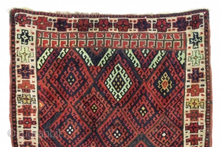 antique kurdish rug with classic diamond design field and some unusual features. Interesting quirky designs added to either end of the field and unusual very light green pile. This very light green  ...