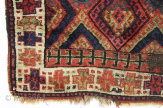 antique kurdish rug with classic diamond design field and some unusual features. Interesting quirky designs added to either end of the field and unusual very light green pile. This very light green  ...