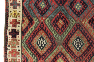 antique kurdish rug with classic diamond design field and some unusual features. Interesting quirky designs added to either end of the field and unusual very light green pile. This very light green  ...