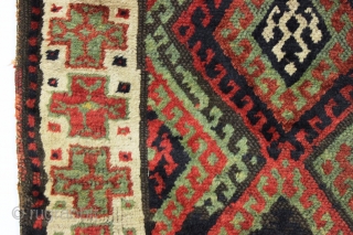 antique kurdish rug with classic diamond design field and some unusual features. Interesting quirky designs added to either end of the field and unusual very light green pile. This very light green  ...