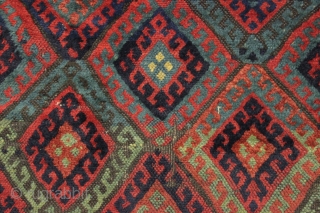 antique kurdish rug with classic diamond design field and some unusual features. Interesting quirky designs added to either end of the field and unusual very light green pile. This very light green  ...