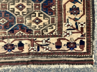 Antique Baluch rug with large scale Memling guls on a soft honey colored ground. Spaciously drawn older type border. Overall fair condition for an older piece with mostly good even pile. Moderately  ...