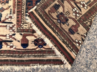 Antique Baluch rug with large scale Memling guls on a soft honey colored ground. Spaciously drawn older type border. Overall fair condition for an older piece with mostly good even pile. Moderately  ...