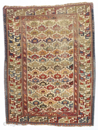 antique ivory ground east caucasian rug with a charming and very unusual design. Probably shirvan. "as found", quite dirty, with scattered wear as shown and some minor edge loss all around. Although  ...