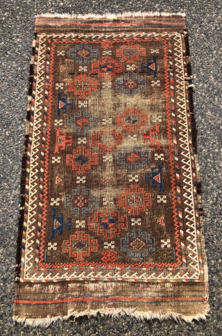 Antique small Baluch rug with an archaic spacious memling gul design and vivid old colors. Al natural colors including strong reds and eye catching light blues. Overall low pile with heavy oxidation  ...