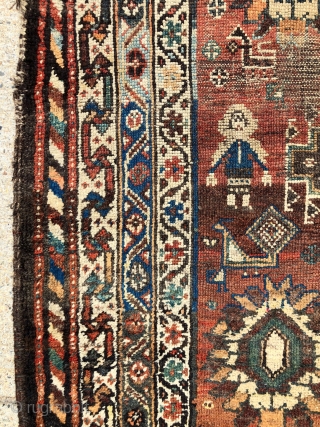 Antique Persian tribal rug with attractive drawing featuring good sized people in fancy dress and charming fan tailed peacocks. Possibly Luri? Overall even low pile with some scattered wear as shown. Interesting  ...