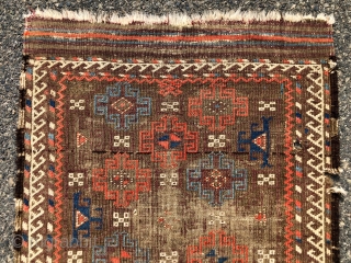 Antique small Baluch rug with an archaic spacious memling gul design and vivid old colors. Al natural colors including strong reds and eye catching light blues. Overall low pile with heavy oxidation  ...