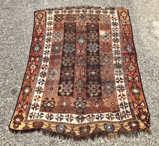Antique Caucasian rug with dark goat hair warps, likely Zakatala. Bold large scale drawing. Interesting all natural color palette. Overall low pile. Selvages not original. End loss. Faded out small old patch  ...
