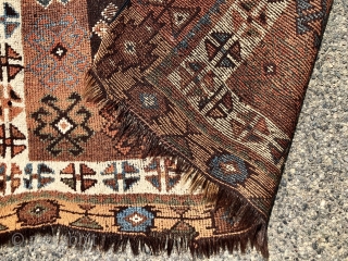 Antique Caucasian rug with dark goat hair warps, likely Zakatala. Bold large scale drawing. Interesting all natural color palette. Overall low pile. Selvages not original. End loss. Faded out small old patch  ...