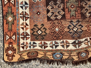 Antique Caucasian rug with dark goat hair warps, likely Zakatala. Bold large scale drawing. Interesting all natural color palette. Overall low pile. Selvages not original. End loss. Faded out small old patch  ...