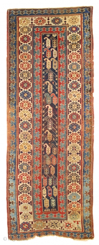 Early caucasian rug. Boteh or boats with oars? Unusually dynamic drawing both in field and borders. I have never seen a field drawn like this. All natural colors including a splendid old  ...