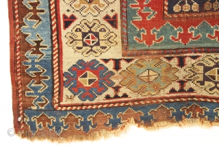 Early caucasian rug. Boteh or boats with oars? Unusually dynamic drawing both in field and borders. I have never seen a field drawn like this. All natural colors including a splendid old  ...