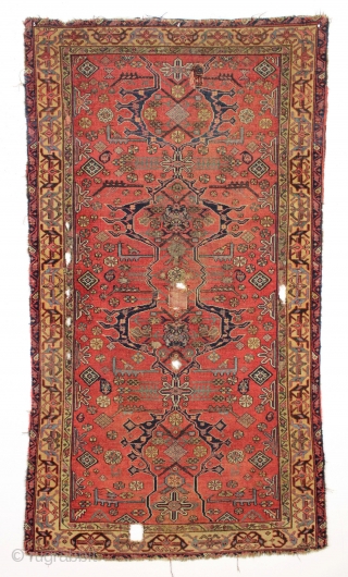 Antique interesting persian village rug. Very dynamic drawing and first rate colors. Mostly fair pile but with damage as shown. "as found" and in need of a good wash. Ca. 1875, probably  ...
