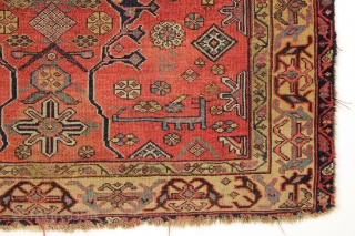 Antique interesting persian village rug. Very dynamic drawing and first rate colors. Mostly fair pile but with damage as shown. "as found" and in need of a good wash. Ca. 1875, probably  ...