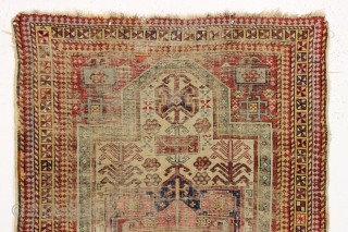 Ghostly antique caucasian rug with an interesting design featuring an unusual border. "As found", thin with allover wear. Appears to have all good original colors. Archaic drawing and not restorable. An interesting  ...