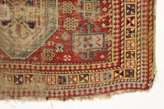 Ghostly antique caucasian rug with an interesting design featuring an unusual border. "As found", thin with allover wear. Appears to have all good original colors. Archaic drawing and not restorable. An interesting  ...