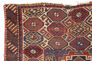 antique kazak with an unusual, if not unique design. The center reserve seems to be a diminutive version of a well known design but the surrounding field is quite eyecatching and inventive.  ...