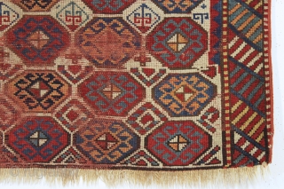 antique kazak with an unusual, if not unique design. The center reserve seems to be a diminutive version of a well known design but the surrounding field is quite eyecatching and inventive.  ...