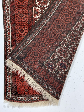 Antique small Baluch rug in reasonably good condition with an unusual field design. The overall lattice field with offset rows of delicate flowers I have not seen before. Nice floppy handle. Scattered  ...