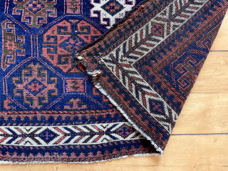 Baluch are hot again. Classic tile field and fish bone border, my favorite. Good age. 19th c.  24” x 28”            