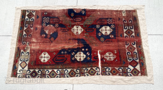 Early pin wheel Kazak fragment. Lovely old colors including eye catching purples. 
Mounted on fabric. Ca. 1800 - 1825. Fragment 3’3” x 5’10”          