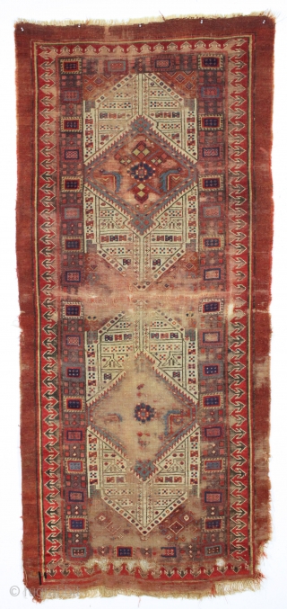 early nw persian rug with eye catching drawing and beautiful old colors. Multiple reds, light blues and a fine old purple. Complete but very much abused with areas of heavy wear and  ...