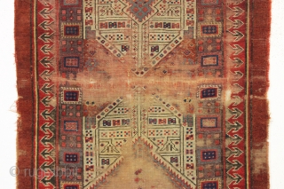 early nw persian rug with eye catching drawing and beautiful old colors. Multiple reds, light blues and a fine old purple. Complete but very much abused with areas of heavy wear and  ...