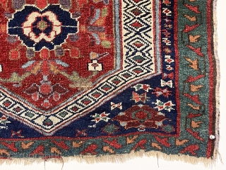 Antique little rug fragment with jewel like color featuring rich greens and lovely purples. Mostly good pile with scattered wear and brown oxidation. The piece constructed of two smaller fragments sewn together.  ...