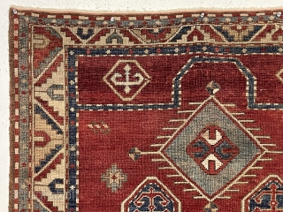 Antique bordjalou Kazak prayer rug. Attractive reasonably early example with spacious drawing. All natural colors. Overall even low pile. Small corner edge gouge and I see a small tear/hole probably old moth.  ...