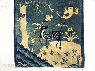 Outstanding diminutive antique Chinese rug. Great double landscaping fantasy with charming flora and fauna. My assumption this weaving is meant to be hung over a chair back or some similar furniture to  ...