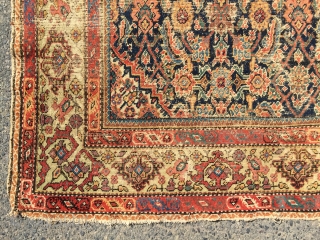 What remains of a genuine antique Persian ferrahan rug. Thin with overall very low pile. Tears, holes and scattered old repairs as shown. Pretty apple green border. Not restorable, good for patches  ...