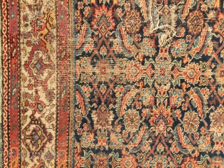 What remains of a genuine antique Persian ferrahan rug. Thin with overall very low pile. Tears, holes and scattered old repairs as shown. Pretty apple green border. Not restorable, good for patches  ...