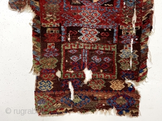 Early east Anatolian Kurdish pile rug fragment. Splendid natural colors with saturation rarely found outside these beautiful weavings. Good fleecy pile with scattered wear, holes, tears and brown oxidation. Edges unraveling. Remnant  ...