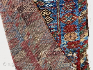 Early east Anatolian Kurdish pile rug fragment. Splendid natural colors with saturation rarely found outside these beautiful weavings. Good fleecy pile with scattered wear, holes, tears and brown oxidation. Edges unraveling. Remnant  ...