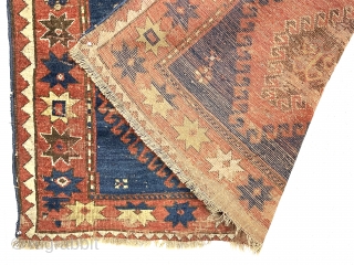 Large Kazak rug. Early? You decide. You might find it exciting or think rubbish and impossible to appreciate. An encyclopedia of condition issues including heavy wear and a good hole.  4’7”  ...