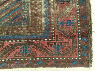 Antique Baluch main carpet. Overall low pile with heavy brown oxidation. All natural colors featuring nice light electric blue highlights. Reasonably clean and intact older example. Nice supple handle and I see  ...