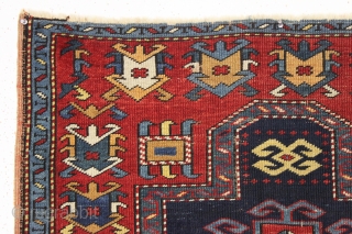 antique small kazak prayer rug. Unusual field ornamentation and a striking light blue border. If palmettes are your thing this is the rug for you. All natural colors including an unusual yellow/gold.  ...