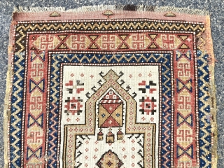 Antique Anatolian ivory ground prayer rug, likely Manastir origin. Lovely archaic drawing and characteristic use of lighter Manastir natural colors. Intact with remnant original selvages and kelim at top. Scattered small old  ...