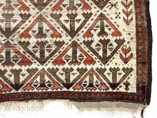 Antique small Baluch rug. Uncommon older ivory ground example. Interesting archaic field design I have not seen before as well as a dramatic design shift surprisingly at the top end. Unusual all  ...