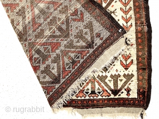 Antique small Baluch rug. Uncommon older ivory ground example. Interesting archaic field design I have not seen before as well as a dramatic design shift surprisingly at the top end. Unusual all  ...