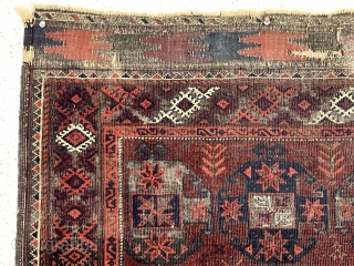 Older Baluch rug with an uncommon design. Overall intact but rough condition with heavily oxidized browns and wear as shown. All natural colors. Appears reasonably clean. An interesting example for study. Priced  ...